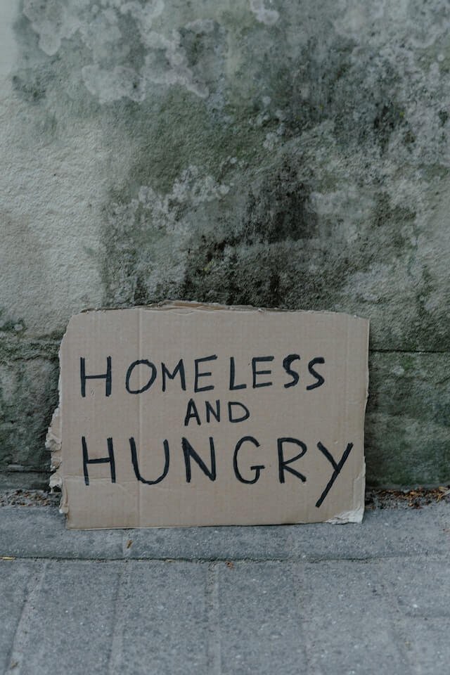Sign with homeless written on it