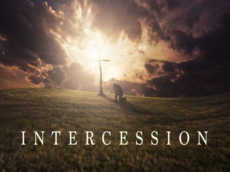 Intercession man praying at foot of the cross